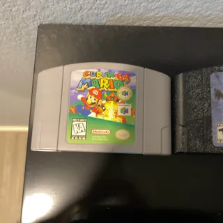 Photo of Nintendo 64 + Games + Cables + Controller