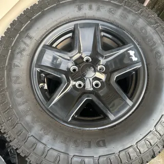 Photo of 285/70/17 Firestone Destination XT tires on 17inch Jeep wheels