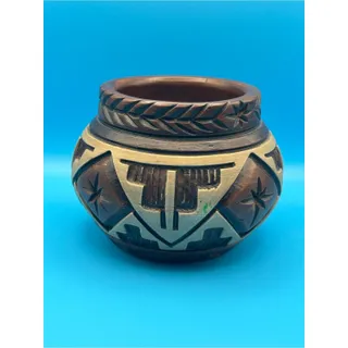 Photo of Handcrafted Pottery with Intricate Carved Geometric Designs
