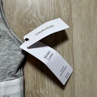 Photo of NWT Calvin Klein Modern Cotton Racerback Sports Bra | Light Gray | Size Small