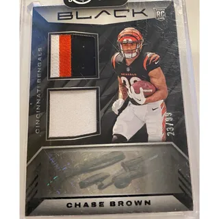 Photo of 2023 Panini Black Chase Brown Rookie Signature Materials RPA 23/99 RSM-7 Bengals