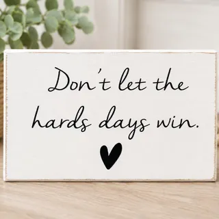 Photo of White wooden sign with black