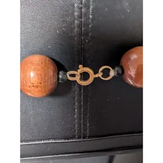 Photo of Necklace Adorned With Multicolored Wooden Beads In Various Sizes