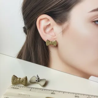 Photo of Gold Glitter Bow Earrings