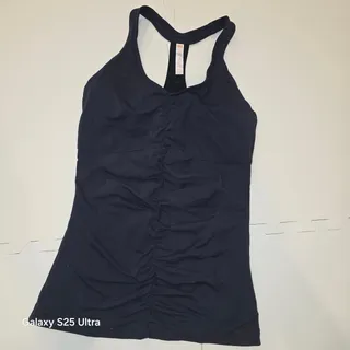 Photo of Lucy, black scrunched front, racerback, athletic top sz M