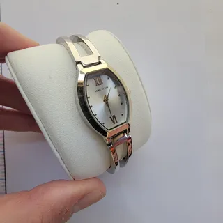 Photo of Anne Klein Womens Watch 32mm Silver Dial Silver Case Gold Bezel Bangle Quartz