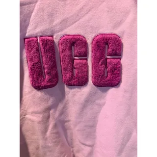 Photo of pink UGG Women's Madeline Fuzzy Logo Crewneck featuring a textured, fuzzy chenille logo