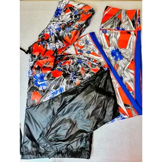 Photo of Nike floral *Hyper Femme* crop windrunner jacket & dri fit leggings