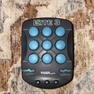 Photo of Tiger Electronics Lite 3 Vintage 1990s Light Up Electronic Hand Held Game