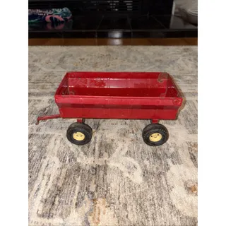 Photo of Vintage ertl 1/16 scale IH red wide tire pressed steel trailer