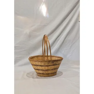 Photo of Small woven wicker basket with handle