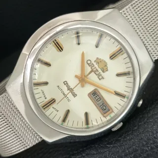 Photo of Vintage 1984 Orient Automatic Mens Silver Watch W/daydate & White accents