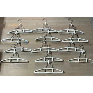Photo of 13 White Plastic Clamp-Style Skirt/Pant Hangers  