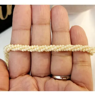 Photo of Vintage Ivory Twisted Beaded Bohemian Glass Necklace 