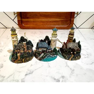 Photo of Thomas Kinkade Lighthouse Collection miniature illuminated lighthouse ornaments