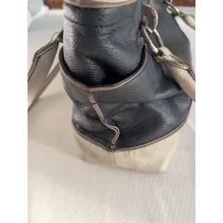 Photo of Tignanello Black Genuine Leather Zip Top Handbag Silver Hardware and Beige trim