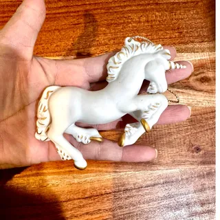 Photo of vintage 80s Hallmark Porcelain Unicorn Christmas Ornament painted gold accents 
